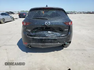 2021 Mazda CX-5 Touring z VIN JM3KFBCM8M0321766, wystawiony jako Copart lot #52845085 z przebiegiem 115 627 mil mil oraz Szkody całkowita. Historia ofert i sprzedaży dostępna na DreamBid. Obrazek 6.