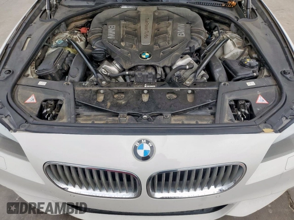 2012 BMW 5 Series 550i z VIN WBAFR9C50CDV58680, wystawiony jako Copart lot #54892735 z przebiegiem 169 263 mil mil oraz Szkoda całkowita • Salvage title. Historia ofert i sprzedaży dostępna na DreamBid. Obrazek 11.