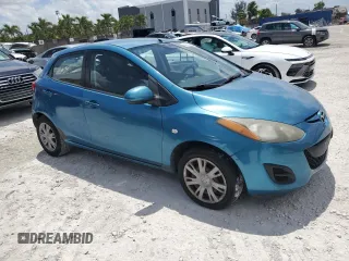 2011 Mazda 2 Sport with VIN JM1DE1HY0B0122590, listed as a Copart auction lot 56162515 with 140,847 mi miles and Clean Title. Bid and sale history available at DreamBid. Image 4.