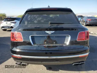 2019 Bentley Bentayga V8 z VIN SJAAM2ZV5KC024154, wystawiony jako Copart lot #74990344 z przebiegiem 41 589 mil mil oraz Szkoda całkowita • Salvage title. Historia ofert i sprzedaży dostępna na DreamBid. Obrazek 6.
