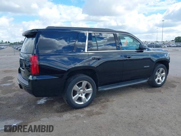 2015 Chevrolet Tahoe LT with VIN 1GNSCBKCXFR214072, listed as a IAAI auction lot 40512435 with 98,955 mi miles and . Bid and sale history available at DreamBid. Image 4.
