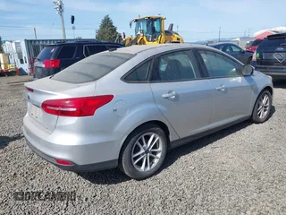 2017 Ford Focus SE with VIN 1FADP3F2XHL304413, listed as a IAAI auction lot 41939334 with 106,074 mi miles and . Bid and sale history available at DreamBid. Image 4.