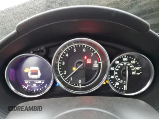 2022 Mazda MX-5 Miata Grand Touring z VIN JM1NDAM77N0501546, wystawiony jako Copart lot #82161264 z przebiegiem 12 245 mil mil oraz Szkoda całkowita • Salvage title. Historia ofert i sprzedaży dostępna na DreamBid. Obrazek 9.