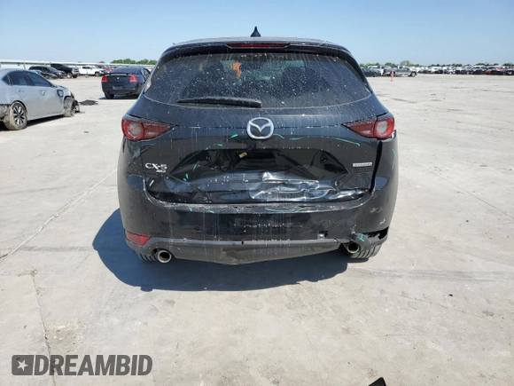 2021 Mazda CX-5 Touring z VIN JM3KFBCM8M0321766, wystawiony jako Copart lot #52845085 z przebiegiem 115 627 mil mil oraz Szkody całkowita. Historia ofert i sprzedaży dostępna na DreamBid. Obrazek 6.