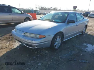 2004 Oldsmobile Alero GL1 z VIN 1G3NL52E94C189058, wystawiony jako IAAI lot #41224615 z przebiegiem 208 921 mil mil oraz . Historia ofert i sprzedaży dostępna na DreamBid. Obrazek 2.