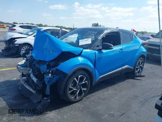 2019 Toyota C-HR XLE with VIN NMTKHMBX6KR097934, listed as a IAAI auction lot 39276687 with 56,973 mi miles. Bid and sale history available at carsss.com. Image 16.