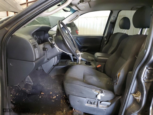 2002 Jeep Grand Cherokee Laredo with VIN 1J4GW48N52C240077, listed as a Copart auction lot 55919394 with 223,991 mi miles and Clean Title. Bid and sale history available at carsss.com. Image 7.
