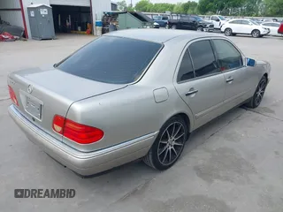 1999 Mercedes-Benz E-Class with VIN WDBJF65H9XA799820, listed as a IAAI auction lot 41959156 with 150,133 mi miles. Bid and sale history available at carsss.com. Image 4.