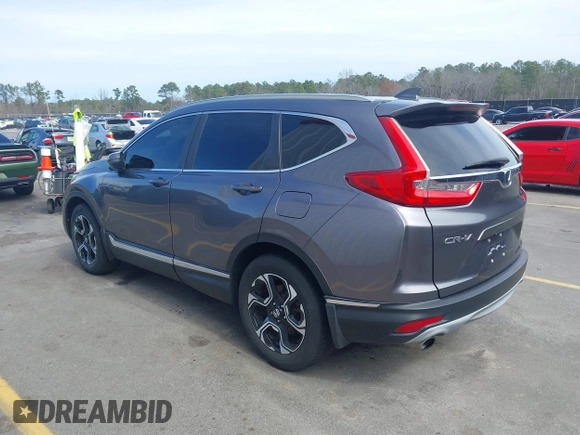 2018 Honda CR-V Touring with VIN 7FARW1H9XJE018575, listed as a IAAI auction lot 41747192 with 83,699 mi miles and . Bid and sale history available at carsss.com. Image 3.