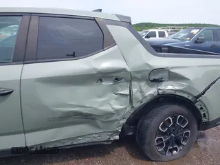 2022 Hyundai Santa Cruz SEL with VIN 5NTJB4AEXNH034989, listed as a IAAI auction lot 42176050 with 27,297 mi miles and . Bid and sale history available at DreamBid. Image 6.