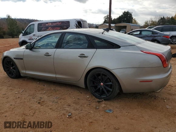 2014 Jaguar XJ with VIN SAJWA1CZ5E8V71971, listed as a Copart auction lot 82116114 with 127,164 mi miles and Salvage Title. Bid and sale history available at DreamBid. Image 2.