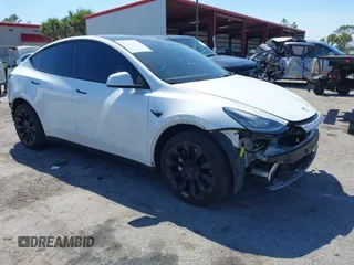 2022 Tesla Model Y Long Range with VIN 7SAYGAEE8NF431786, listed as a IAAI auction lot 41750353 with 67,846 mi miles and . Bid and sale history available at carsss.com. Image 1.