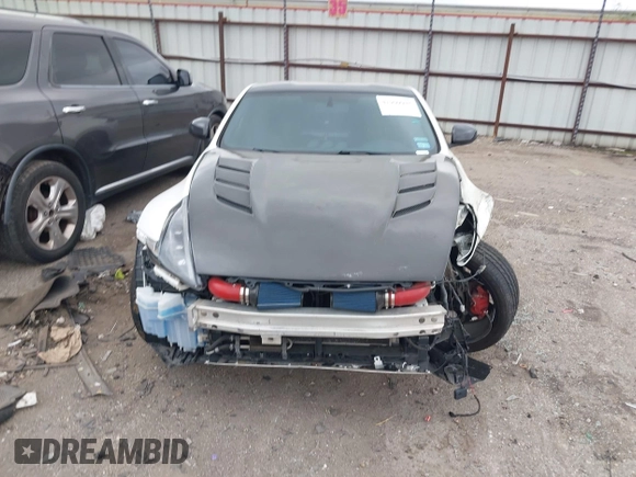 2016 Nissan 370Z Sport z VIN JN1AZ4EH1GM930883, wystawiony jako IAAI lot #41909945 z przebiegiem 80 484 mil mil oraz . Historia ofert i sprzedaży dostępna na DreamBid. Obrazek 13.