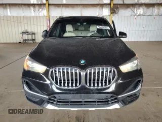 2021 BMW X1 sDrive28i z VIN WBXJG7C02M5S30154, wystawiony jako Copart lot #56076565 z przebiegiem 57 671 mil mil oraz Tytuł czysty. Historia ofert i sprzedaży dostępna na DreamBid. Obrazek 5.