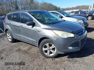 2014 Ford Escape SE with VIN 1FMCU9GX1EUB04131, listed as a IAAI auction lot 41899521 with 239,623 mi miles. Bid and sale history available at carsss.com. Image 1.