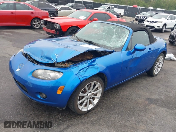 2006 Mazda MX-5 Miata Touring z VIN JM1NC25FX60102209, wystawiony jako IAAI lot #41940771 z przebiegiem 165 003 mil mil oraz . Historia ofert i sprzedaży dostępna na DreamBid. Obrazek 17.