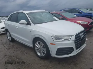 2018 Audi Q3 Premium with VIN WA1ECCFS1JR008297, listed as a IAAI auction lot 40857524 with 117,499 mi miles. Bid and sale history available at carsss.com. Image 1.