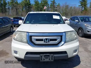 2011 Honda Pilot Touring with VIN 5FNYF4H98BB087713, listed as a IAAI auction lot 42132764 with 250,507 mi miles. Bid and sale history available at carsss.com. Image 13.