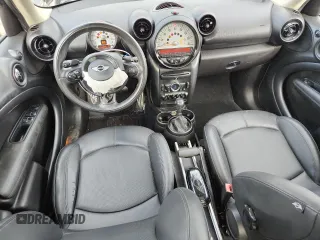 2014 MINI Countryman S with VIN WMWZC3C56EWP25479, listed as a Copart auction lot 61197525 with 101,146 mi miles and Salvage title. Bid and sale history available at DreamBid. Image 8.