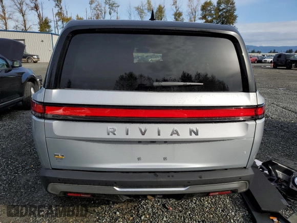 2023 Rivian R1S Adventure z VIN 7PDSGABAXPN019516, wystawiony jako Copart lot #73248104 z przebiegiem 11 525 mil mil oraz Szkody całkowita. Historia ofert i sprzedaży dostępna na DreamBid. Obrazek 6.