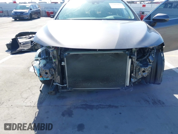 2019 Toyota Camry LE with VIN 4T1B11HK2KU240465, listed as a IAAI auction lot 42095075 with 67,852 mi miles and . Bid and sale history available at DreamBid. Image 6.