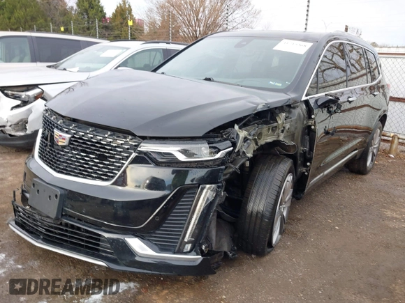 2021 Cadillac XT6 Premium Luxury z VIN 1GYKPDRS9MZ120150, wystawiony jako IAAI lot #41715368 z przebiegiem 47 835 mil mil oraz . Historia ofert i sprzedaży dostępna na DreamBid. Obrazek 19.