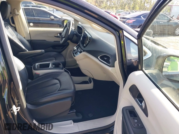 2023 Chrysler Pacifica Touring L with VIN 2C4RC1BG1PR606566, listed as a IAAI auction lot 42615498 with 42,980 mi miles and . Bid and sale history available at DreamBid. Image 5.