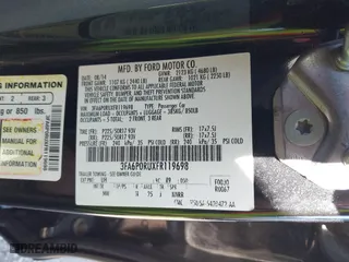 2015 Ford Fusion Titanium Hybrid with VIN 3FA6P0RUXFR119698, listed as a IAAI auction lot 41791411 with 140,646 mi miles. Bid and sale history available at carsss.com. Image 9.