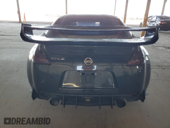 2009 Nissan 370Z z VIN JN1AZ44E19M411715, wystawiony jako Copart lot #56654815 z przebiegiem 123 791 mil mil oraz Szkoda całkowita • Salvage title. Historia ofert i sprzedaży dostępna na DreamBid. Obrazek 6.