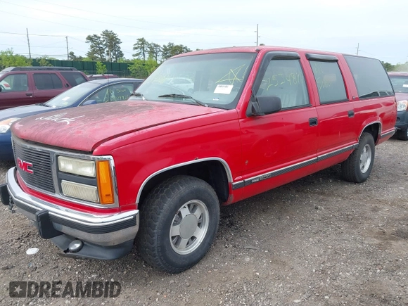 1992 GMC Suburban z VIN 1GKEC16K9NJ722021, wystawiony jako IAAI lot #42255371 z przebiegiem 180 966 mil mil oraz . Historia ofert i sprzedaży dostępna na DreamBid. Obrazek 2.