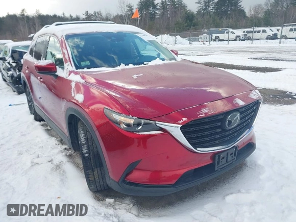 2022 Mazda CX-9 Touring Plus z VIN JM3TCBAY0N0619152, wystawiony jako IAAI lot #41489705 z przebiegiem 18 664 mil mil oraz . Historia ofert i sprzedaży dostępna na DreamBid. Obrazek 1.