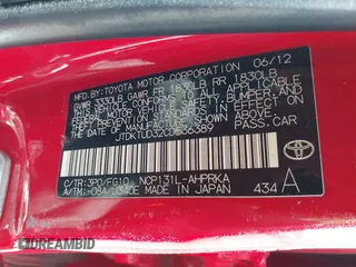 2012 Toyota Yaris L with VIN JTDKTUD32CD536389, listed as a IAAI auction lot 42020928 with 138,379 mi miles. Bid and sale history available at carsss.com. Image 9.