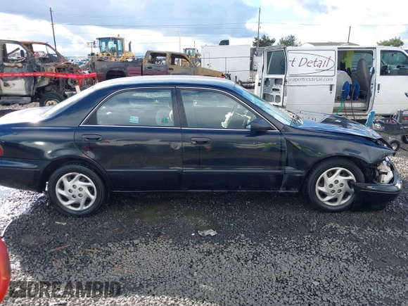 2000 Mazda 626 LX z VIN 1YVGF22CXY5123930, wystawiony jako IAAI lot #40712369 z przebiegiem 210 234 mil mil oraz . Historia ofert i sprzedaży dostępna na DreamBid. Obrazek 13.