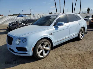 2019 Bentley Bentayga V8 z VIN SJAAM2ZV9KC026988, wystawiony jako Copart lot #73576964 z przebiegiem 31 162 mil mil oraz Szkoda całkowita • Salvage title. Historia ofert i sprzedaży dostępna na DreamBid. Obrazek 1.