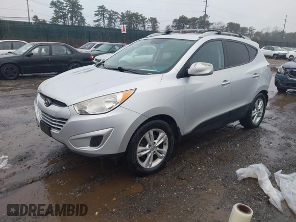 2011 Hyundai Tucson Limited with VIN KM8JUCAC9BU200367, listed as a IAAI auction lot 41867617 with 228,456 mi miles and . Bid and sale history available at DreamBid. Image 2.