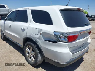 2013 Dodge Durango SXT with VIN 1C4RDHAG0DC696904, listed as a IAAI auction lot 42310831 with 112,964 mi miles and . Bid and sale history available at DreamBid. Image 3.