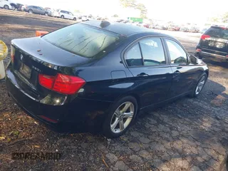 2015 BMW 3 Series 328i with VIN WBA3A5C59FF609332, listed as a IAAI auction lot 41994091 with 194,245 mi miles. Bid and sale history available at carsss.com. Image 4.