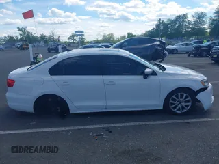 2012 Volkswagen Jetta SE z VIN 3VWDX7AJ7CM362001, wystawiony jako IAAI lot #42209146 z przebiegiem 200 566 mil mil oraz . Historia ofert i sprzedaży dostępna na DreamBid. Obrazek 14.