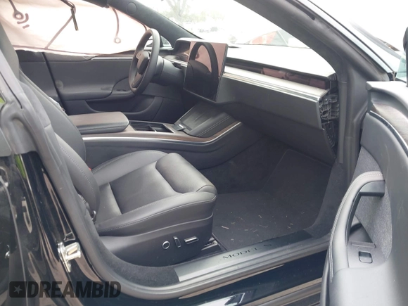 2023 Tesla Model S with VIN 5YJSA1E52PF500088, listed as a IAAI auction lot 41372918 with Not provided miles and . Bid and sale history available at DreamBid. Image 5.