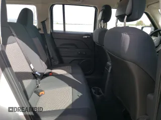 2010 Jeep Patriot Sport z VIN 1J4NT2GB4AD523378, wystawiony jako Copart lot #57088185 z przebiegiem 119 937 mil mil oraz Szkoda całkowita • Salvage title. Historia ofert i sprzedaży dostępna na DreamBid. Obrazek 11.