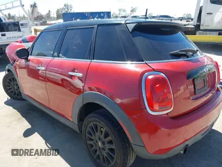 2017 MINI Hardtop 4 Door Cooper z VIN WMWXU1C57H2E18670, wystawiony jako IAAI lot #41950314 z przebiegiem 94 199 mil mil oraz . Historia ofert i sprzedaży dostępna na DreamBid. Obrazek 3.