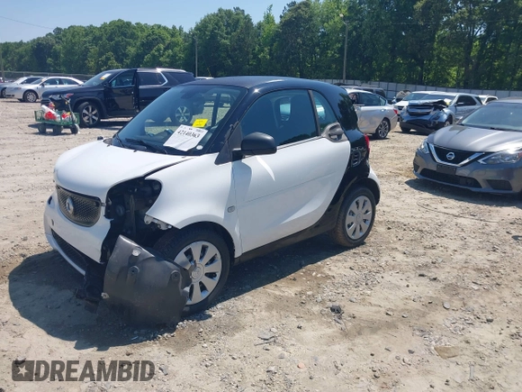 2016 Smart fortwo Passion z VIN WMEFJ5DA6GK078340, wystawiony jako IAAI lot #42140363 z przebiegiem 114 647 mil mil oraz . Historia ofert i sprzedaży dostępna na DreamBid. Obrazek 18.