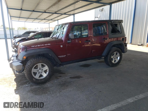 2010 Jeep Wrangler Unlimited Rubicon with VIN 1J4BA6H18AL197855, listed as a Copart auction lot 57748185 with 147,899 mi miles and Salvage title. Bid and sale history available at DreamBid. Image 1.
