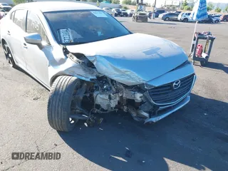 2017 Mazda 3 Touring with VIN JM1BN1V72H1106185, listed as a IAAI auction lot 42697405 with 110,324 mi miles and . Bid and sale history available at DreamBid. Image 6.