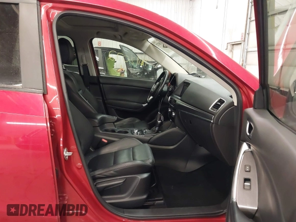 2016 Mazda CX-5 Grand Touring with VIN JM3KE4DY7G0731057, listed as a IAAI auction lot 41118072 with 134,107 mi miles and . Bid and sale history available at carsss.com. Image 5.