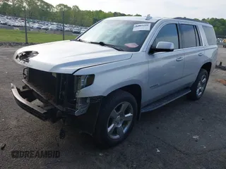 2019 Chevrolet Tahoe LT with VIN 1GNSCBKCXKR219413, listed as a IAAI auction lot 42013260 with 92,886 mi miles and . Bid and sale history available at DreamBid. Image 2.