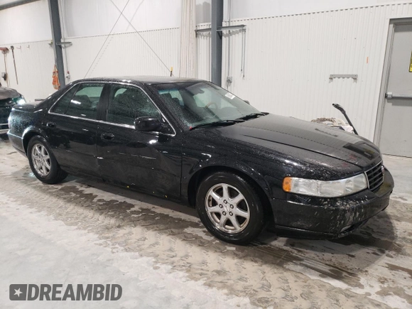 2002 Cadillac Seville Touring STS z VIN 1G6KY54962U158476, wystawiony jako Copart lot #86624774 z przebiegiem 77 818 mil mil oraz Szkoda całkowita • Salvage title. Historia ofert i sprzedaży dostępna na DreamBid. Obrazek 4.