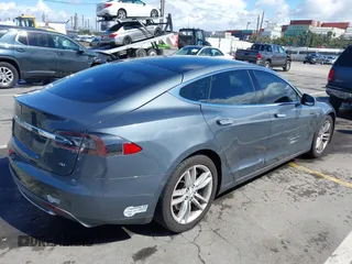 2014 Tesla Model S 60 with VIN 5YJSA1S15EFP29010, listed as a IAAI auction lot 41798180 with 142,754 mi miles and . Bid and sale history available at DreamBid. Image 4.