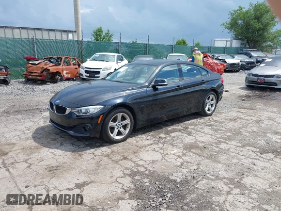 2015 BMW 4 Series 428i xDrive with VIN WBA4C9C52FD331620, listed as a IAAI auction lot 42556526 with 115,674 mi miles and . Bid and sale history available at DreamBid. Image 2.