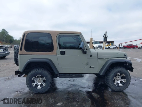 1999 Jeep Wrangler Sahara with VIN 1J4FY49S0XP480017, listed as a IAAI auction lot 41642577 with 154,068 mi miles. Bid and sale history available at carsss.com. Image 13.